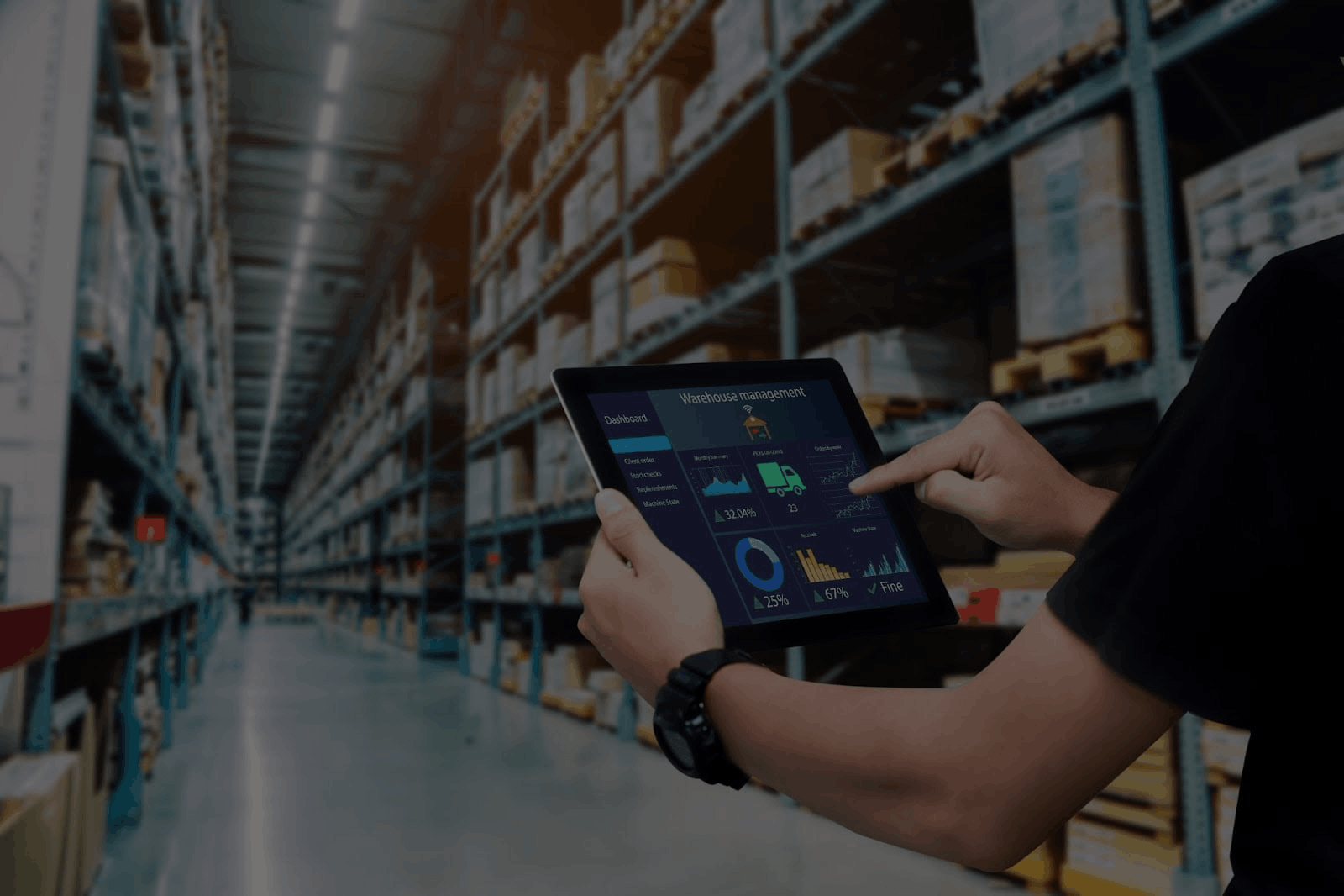 Person using a tablet in a warehouse filled with shelves and boxes, representing inventory monitoring and logistics.